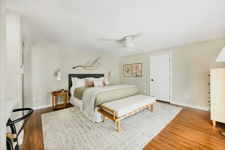 Spacious casita bedroom with king bed, writing desk, and kitchenette view at Biskra House vacation rental in Rancho Mirage.